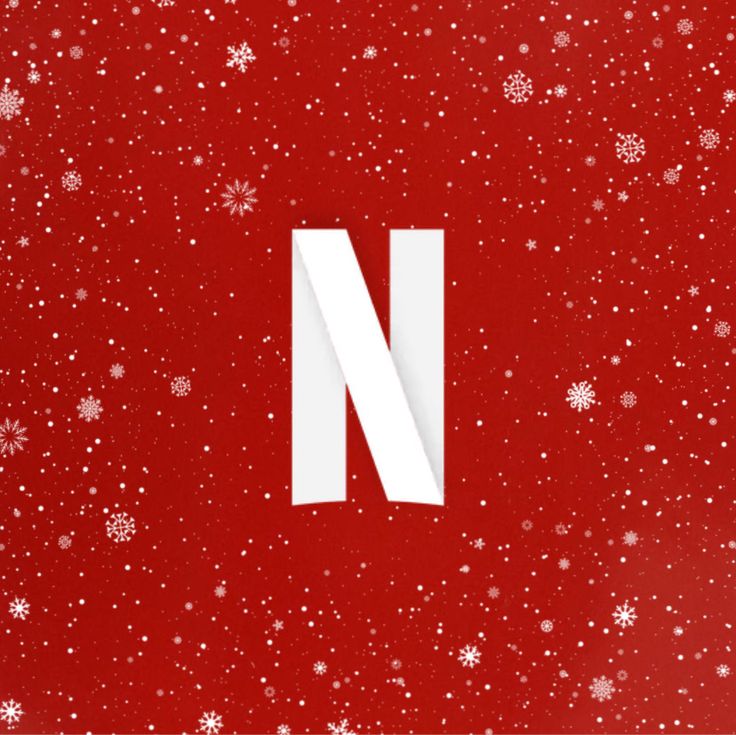 the letter n is surrounded by snowflakes on a red background with white stars