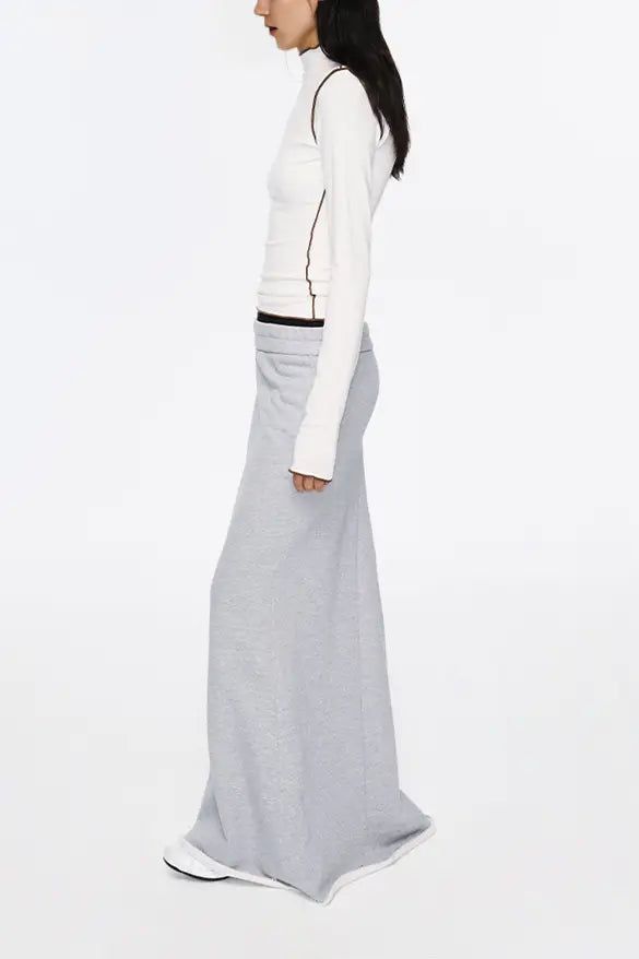 Unveil Laid-back Luxe with Textured Layers Elevate your wardrobe with this ribbed dual-waistband fleece lined mermaid skirt, a testament to comfort meets contemporary design. Crafted from high-weight fleece for a soft and snug feel, this piece boasts a ribbed upper waist that adds a textural dimension while the deliberately widened lower waistband exudes a casual, relaxed vibe. The mermaid tail with a rolled hem injects a carefree, chic look to this versatile piece, perfect for pairing with a sl Low Waist Maxi Skirt, Mermaid Maxi Skirt, Textured Layers, Mermaid Skirt, Mermaid Silhouette, Comfort Wear, Rolled Hem, Mermaid Tail, Casual Tee