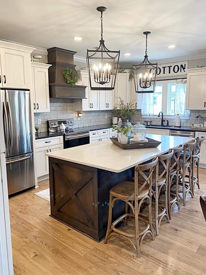 a large kitchen with an island in the middle