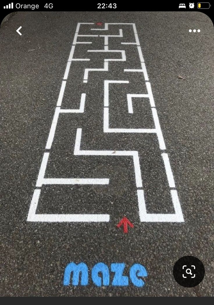 an image of a maze on the street with words make it written in blue and white