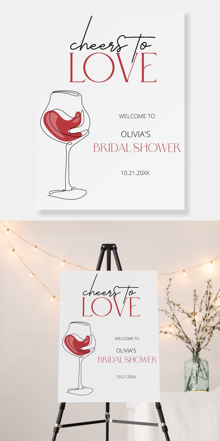 an easel with a wine glass on it and the words cheers to love written in red