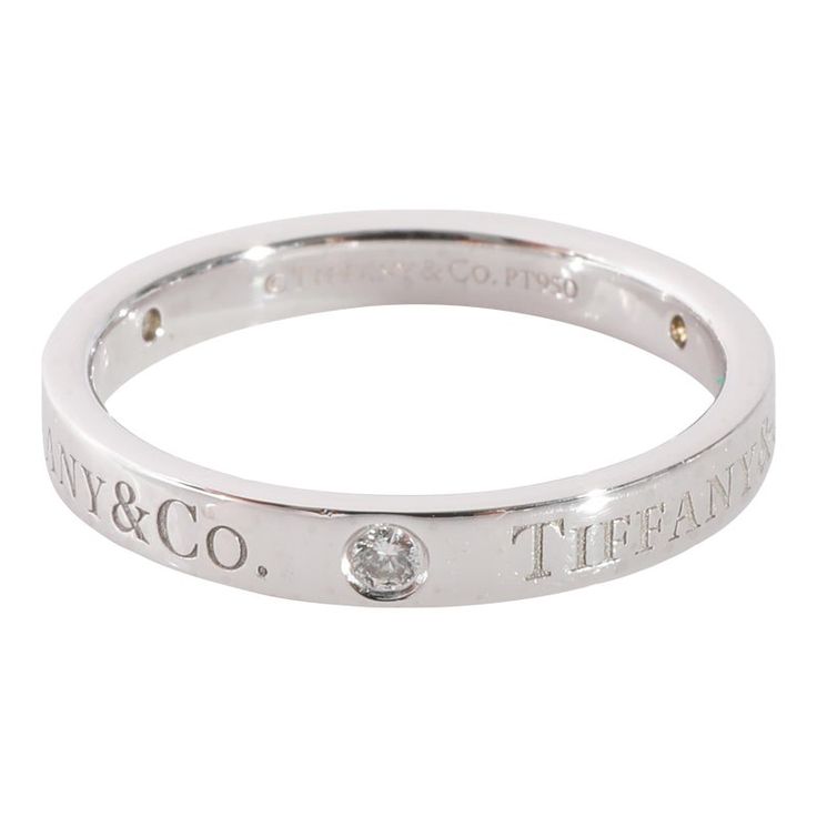 This is part of Chairish’s Fine Jewelry assortment.  Tiffany & Co. Diamond Band in 950 Platinum 0.07 CTW  PRIMARY DETAILS  SKU: 125350  Listing Title: Tiffany & Co. Diamond Band in 950 Platinum 0.07 CTW  Condition Description: Retails for 2250 USD. In excellent condition and recently polished. Ring size is 6.25. Comes with Box.  Brand: Tiffany & Co.  Metal Type: Platinum  Metal Purity: 950  Ring Size: 6.25  Pre-Owned Jewelry Condition: Excellent  SIDE STONE INFORMATION  Side Stone 1 Gem Type: Di Luxury White Gold Ring With Single Diamond, Luxury Promise Ring With Vs Clarity, Vs Clarity Stackable Rings Fine Jewelry, Luxury 14k White Gold Promise Ring, Luxury Diamond White Ring With Polished Finish, Luxury Diamond White Rings With Polished Finish, Luxury Diamond Rings With Polished Finish, Luxury Rings With Polished Finish For Promise, Classic Stackable Rings With Diamond Accents As Gift