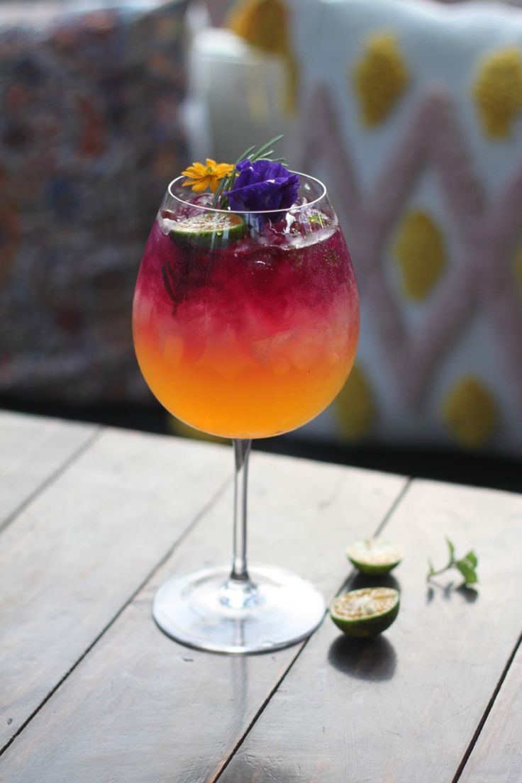 a drink sitting on top of a wooden table