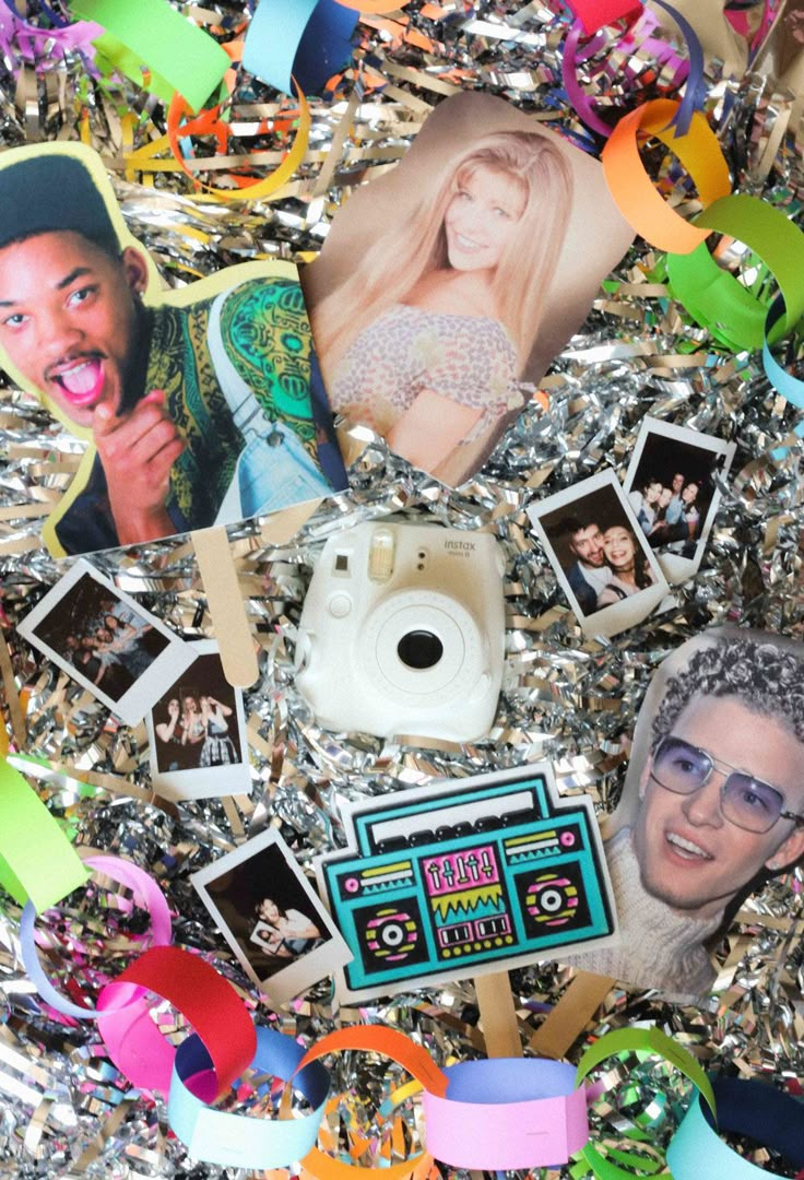 an assortment of photos and confetti on tinsel