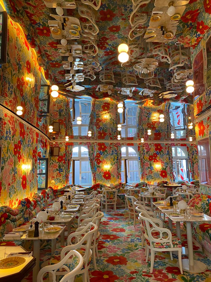 an elaborately decorated restaurant with many tables and chairs