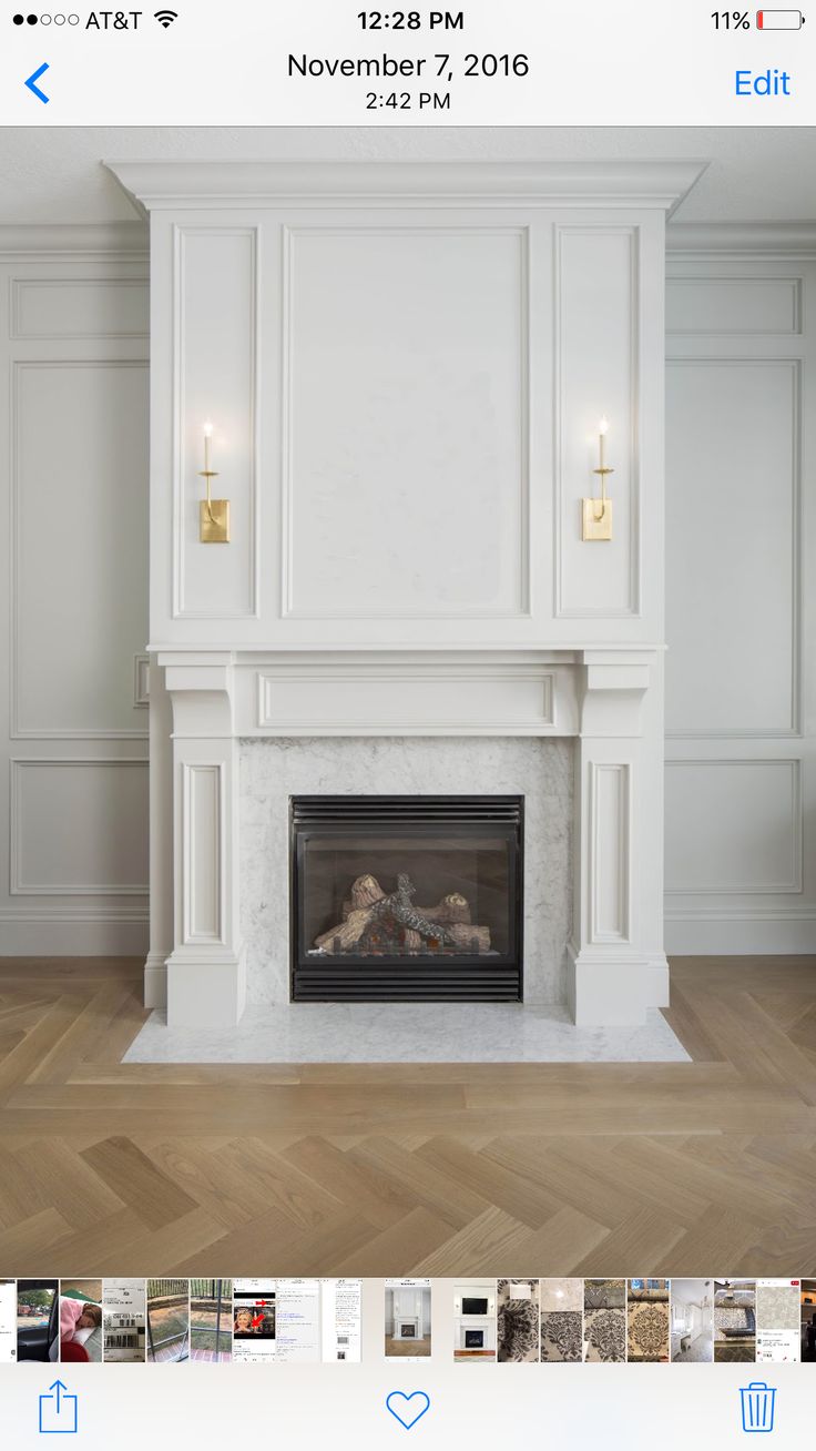 the fireplace is white and has gold trim