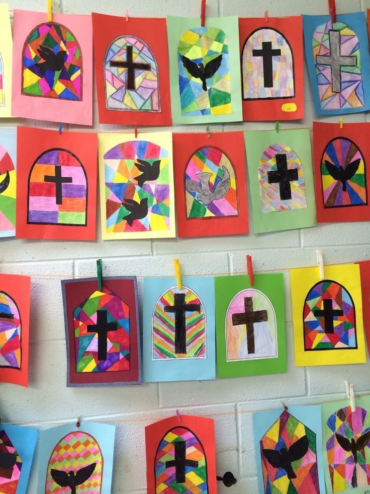 the wall is decorated with colorful paper and crosses