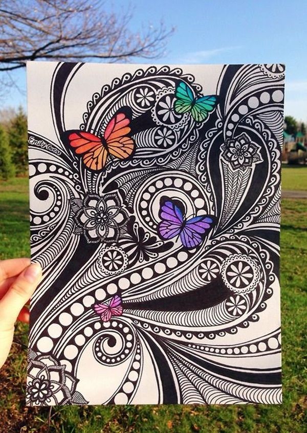 someone is holding up an art piece with butterflies on it, and the image has been drawn