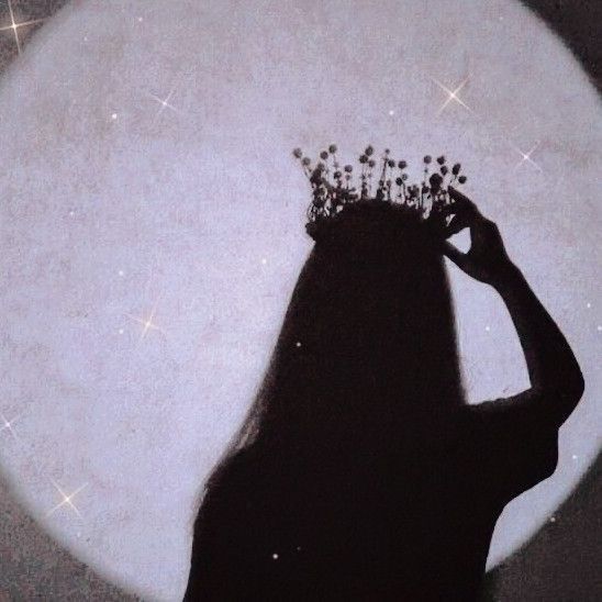 the silhouette of a woman with long hair wearing a tiara