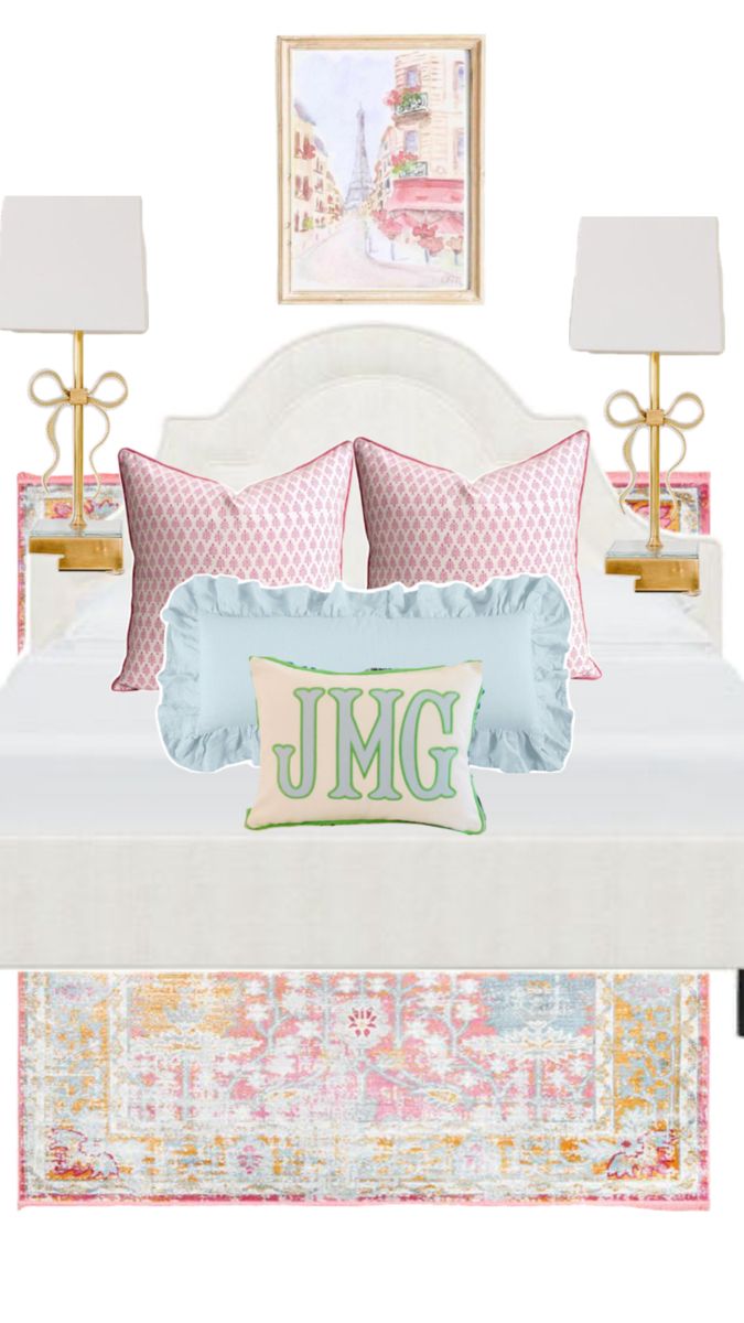 a bed with pink and blue pillows on top of it next to two nightstands