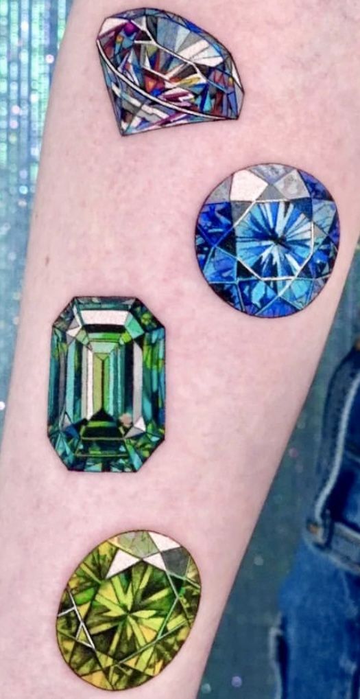 four different colored diamonds on the arm