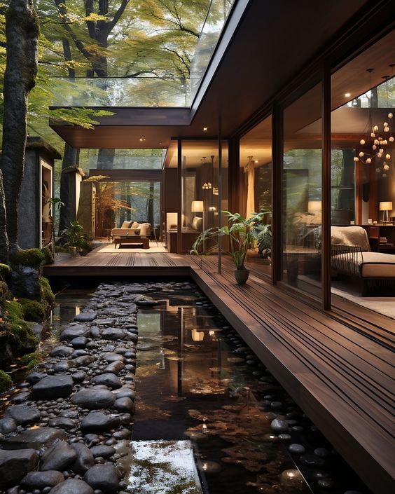 the inside of a modern house with a pond