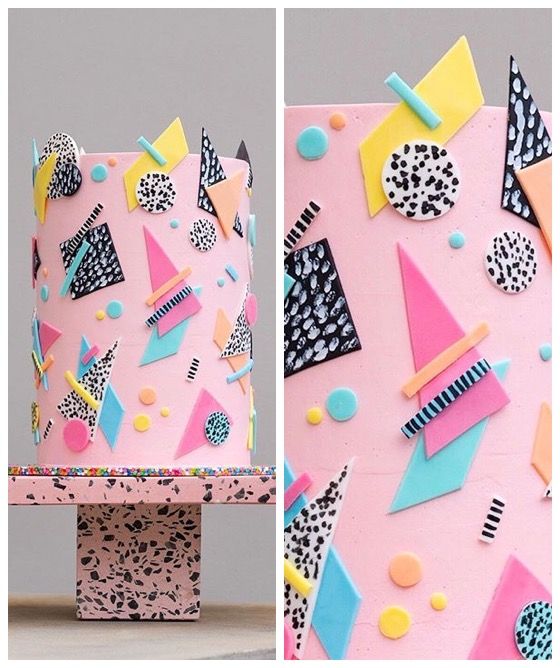 a cake decorated with geometric shapes and dots