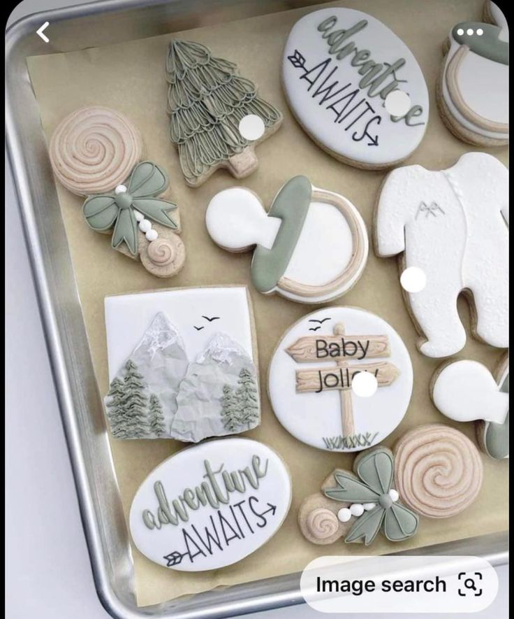 an assortment of decorated cookies in a box