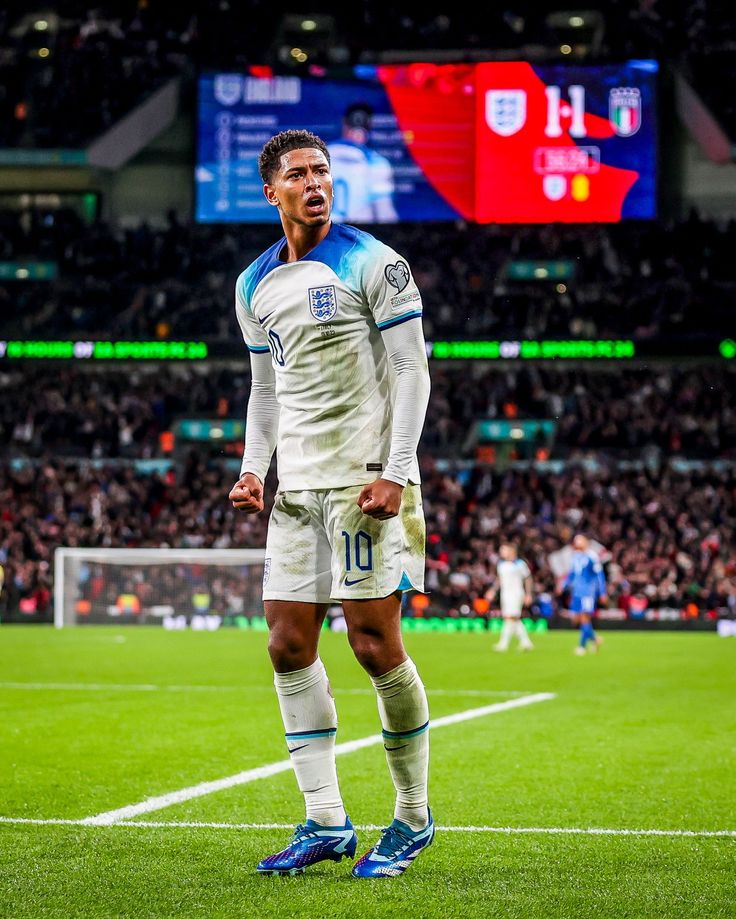 a man standing on top of a soccer field