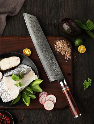 a cutting board topped with fish and vegetables next to a knife on top of it