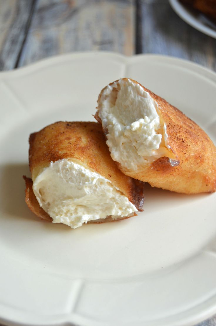 two pieces of food on a white plate