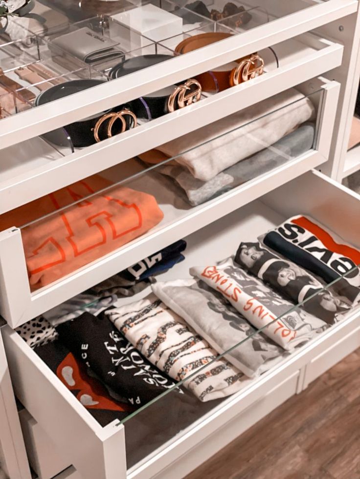 an open drawer with many items in it