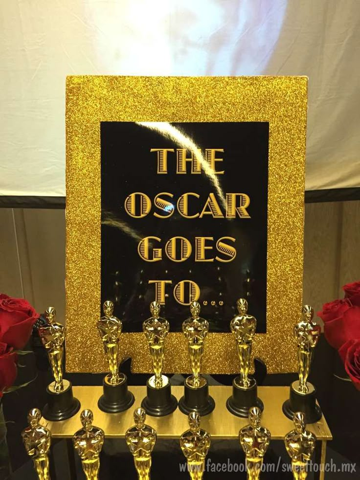 the oscar awards are lined up in front of a sign that reads,'the oscar goes to '