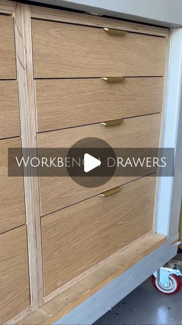 a large wooden dresser sitting next to a wall with the words workben drawers on it