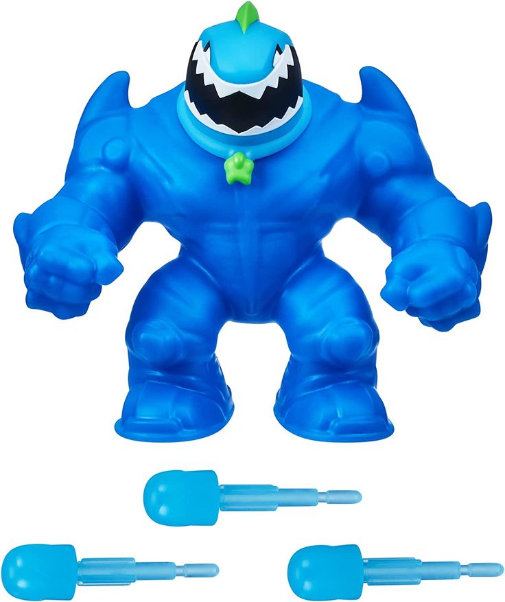 an image of a toy that is in the shape of a blue monster with teeth