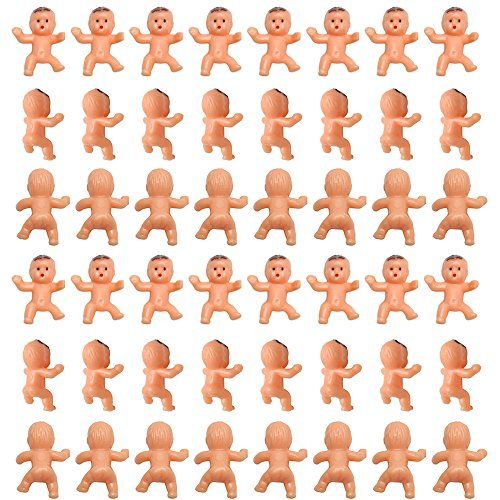 a bunch of small orange plastic toys on a white background