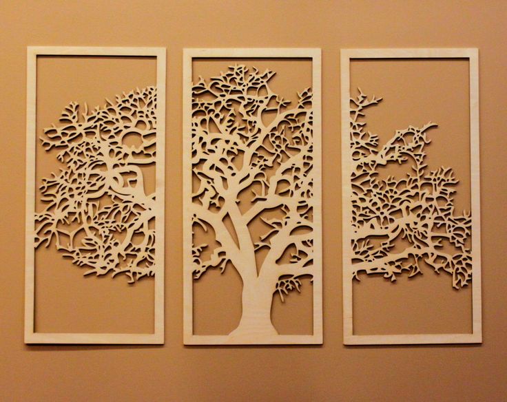 three panels with trees cut out of them