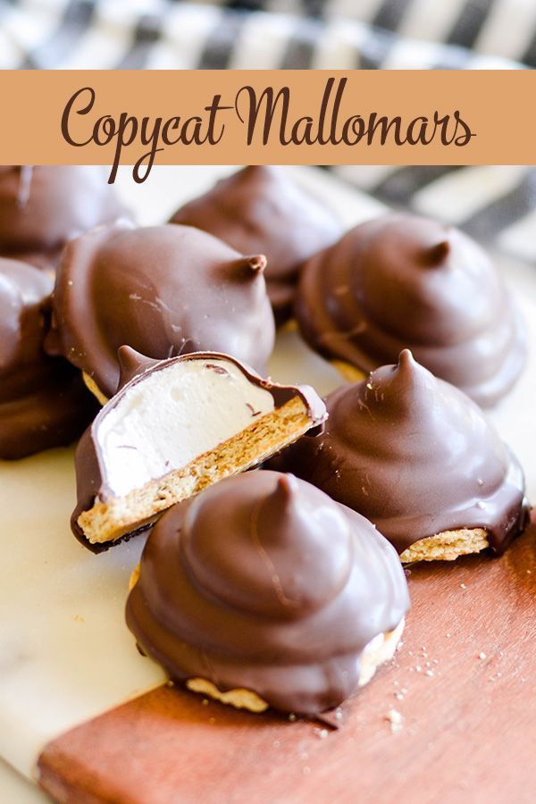 chocolate covered marshmallows sitting on top of a cutting board with the title overlay