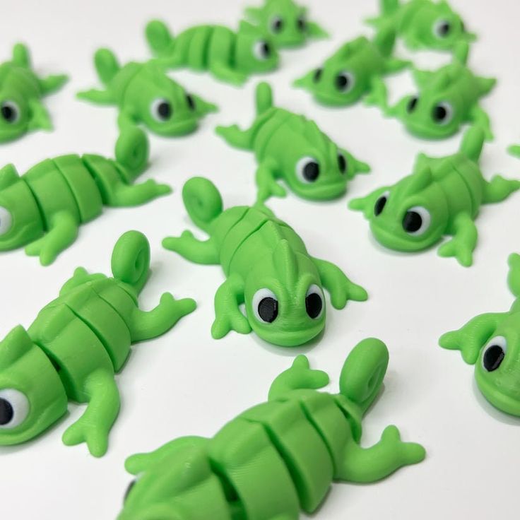 there are many green plastic alligators with googly eyes