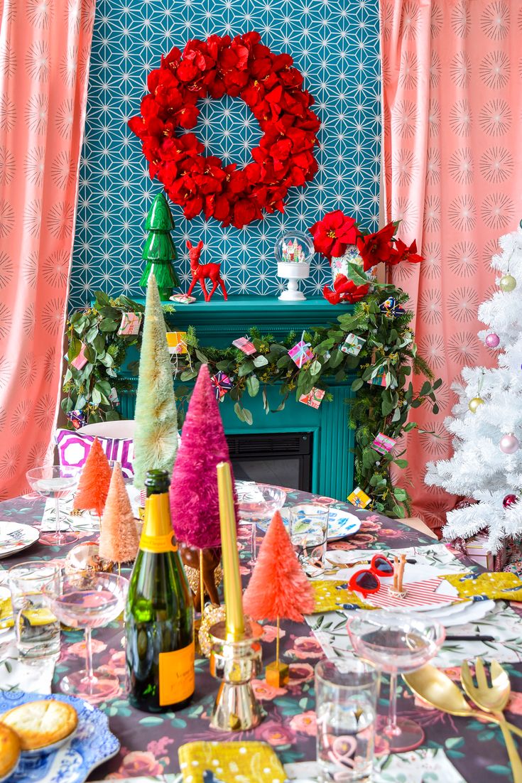 the table is set with colorful christmas decorations