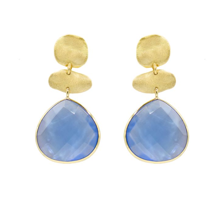 The Tiara Earrings are 18k gold plated, featuring two molten coins with a natural semi-precious stone hanging down, adding an elegant and unique touch. Handmade in Brazil, they measure 1. 75 inches in length. Each pair showcases distinctive textures, shine, and color due to the natural variations in the stones used. These 18k gold plated over brass earrings feature doublet stones, which are essentially mother of pearl combined with a colorful crystal layer. This combination creates a captivating and unique look, enhancing the overall elegance of the earrings. Elegant Blue Hammered Earrings, Elegant Chalcedony Earrings With Natural Stones, Handmade Gold Earrings With Chalcedony, Gold Chalcedony Dangle Earrings, Contemporary Earrings, August Birthstone Jewelry, July Birthstone Jewelry, Pearl Jewellery Earrings, Jewelry Ring Box