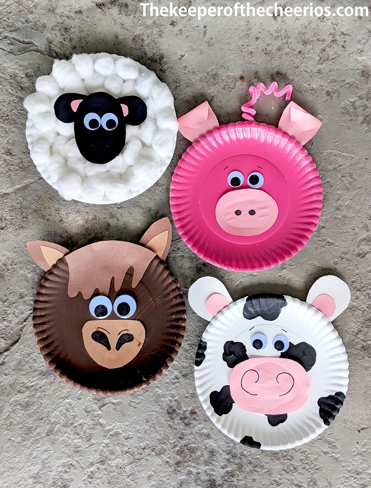 three paper plates with farm animals on them, one is pink and the other is brown