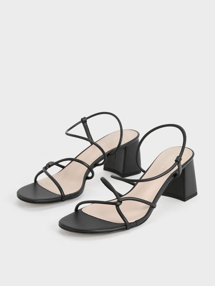 An elegant pair of strappy sandals looks good dressed up or down, and this pair of Meadow sandals will certainly get the job done. Featuring a distinctive interlaced design, these sandals feature swooping lines that create a flattering fit. With the polished versatility of the black finish and leg-lengthening lift of the block heels, they are the perfect pair for both dressy and casual occasions. Strappy Block Heel Sandals, Strappy Block Heels, Block Heel Sandals, Black Sandals Heels, Charles Keith, Block Heels Sandal, Heel Sandals, Strappy Sandals, The Block