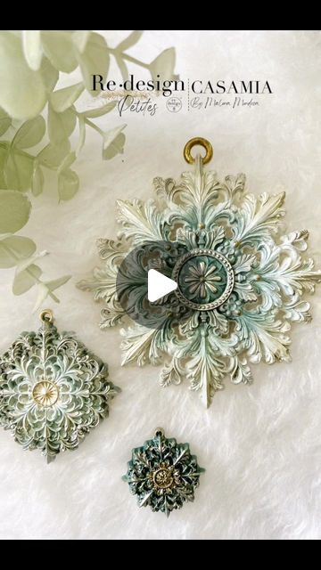 the video shows how to make an intricate brooch with filigreen flowers