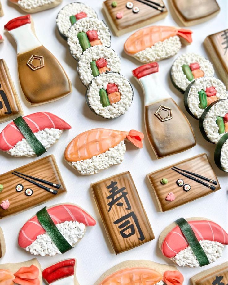 sushi cookies are arranged on a white surface