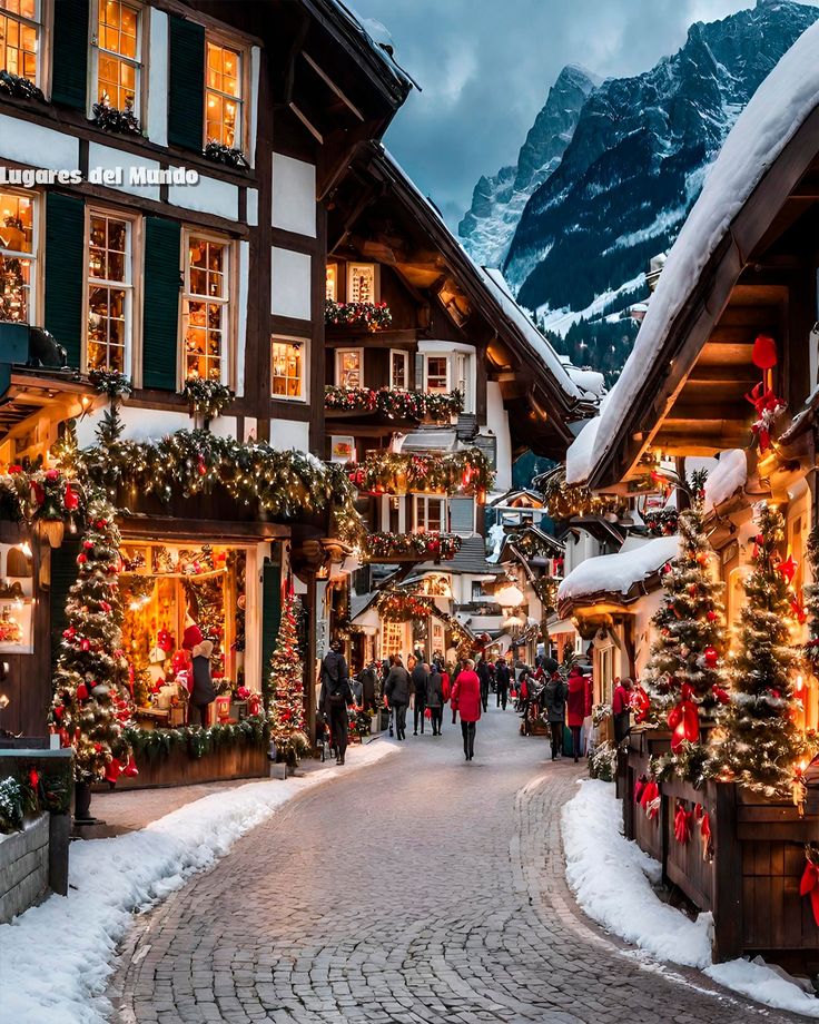 christmas decorations adorn the streets of an alpine village in germany, decorated with lights and garlands