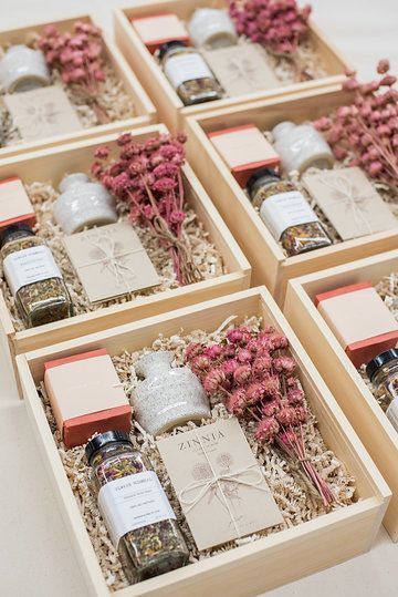 four boxes filled with different types of condiments and seasonings on top of a table