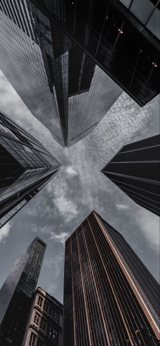 looking up at tall buildings in the city