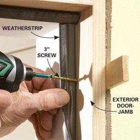 a person using a cordless drill to fix a window frame with screwdrivers