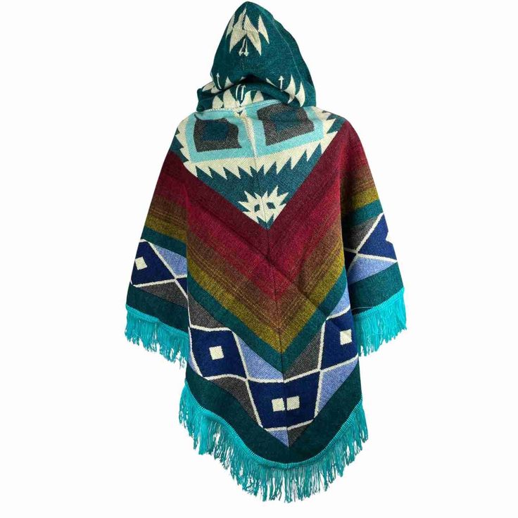 Stay cozy and stylish this fall and winter season with this stunning outerwear piece. This beautiful hooded poncho is the perfect addition to your wardrobe, combining the best of traditional poncho design with a modern twist. Handcrafted with love, this cloak is made from high-quality wool fabric, ensuring warmth and comfort in chilly weather. Its versatile style makes it ideal for both casual and formal occasions, and it can be easily paired with your favorite jeans or dresses. Embrace your inn Cozy Winter Poncho With Fringe, Casual Winter Poncho With Tassels, Multicolor Fringe Winter Outerwear, Green Hooded Cape For Fall, Blue Hooded Winter Cape, Hooded Green Cape For Fall, One Size Winter Outerwear With Fringe, Blue Tasseled Outerwear For Fall, Winter Fringe Cape Outerwear