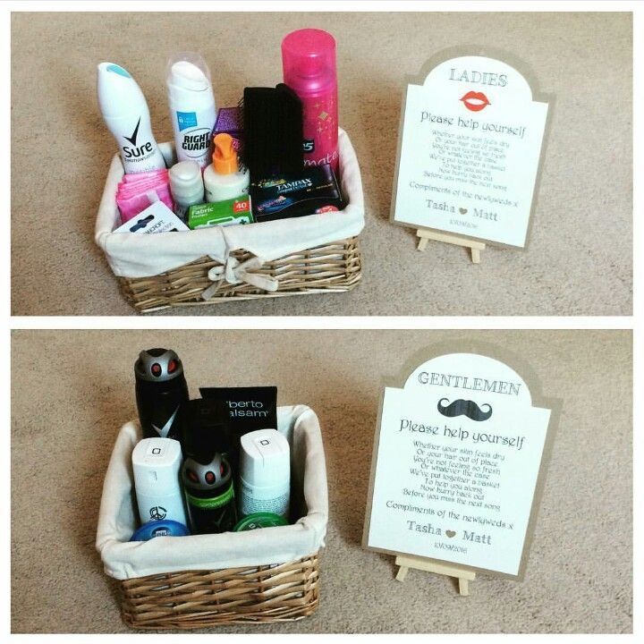 two baskets with personal care items in them sitting on the floor next to a sign