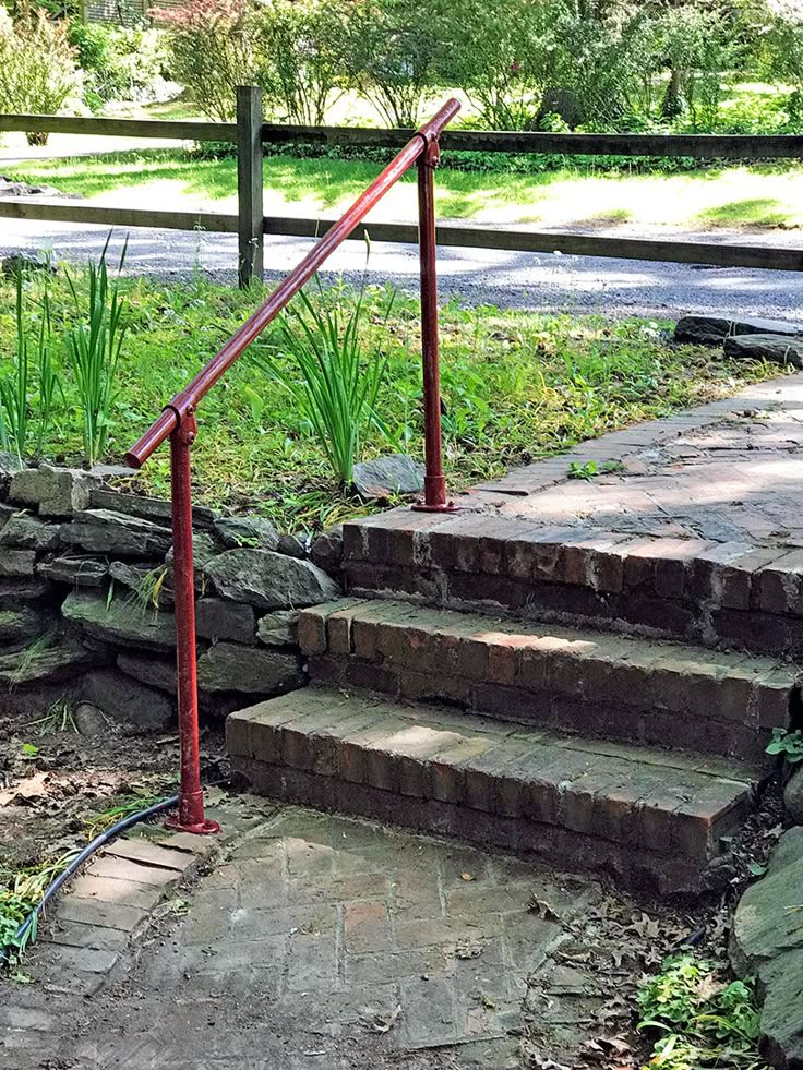 a fire hydrant sitting on top of stone steps