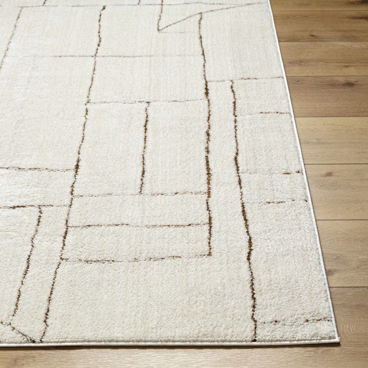 a white rug with lines on the floor