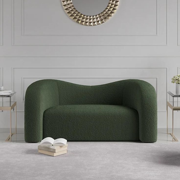 a green chair sitting on top of a white floor next to a mirror and table