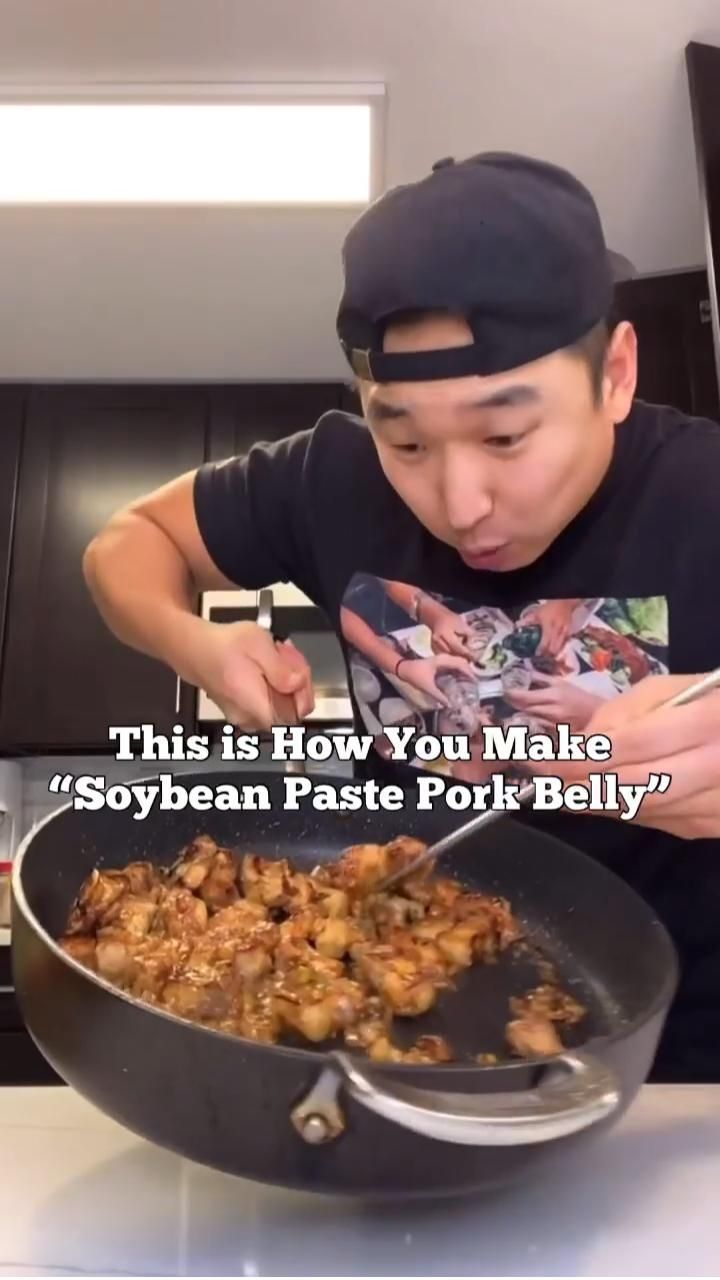 a man is cooking food in a skillet on the table with words above it