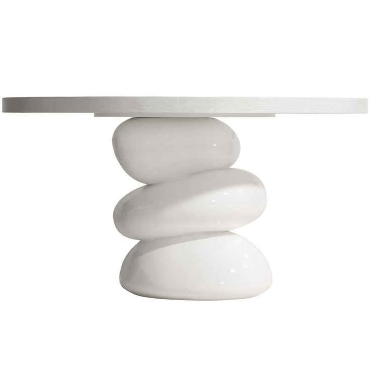 a white table that has some rocks on it