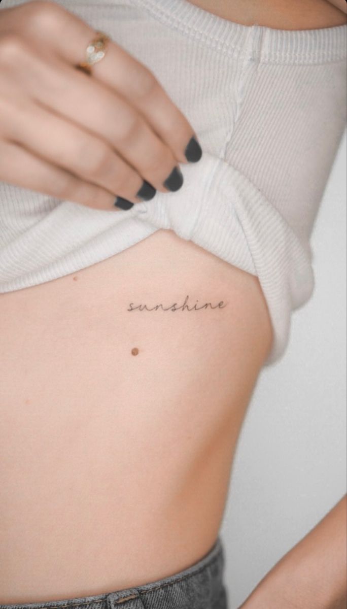 a woman's stomach with the word sunshine written on it