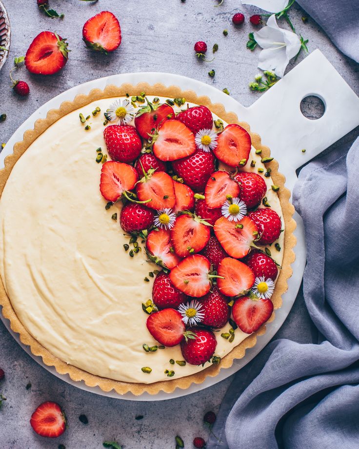 there is a pie with strawberries on it