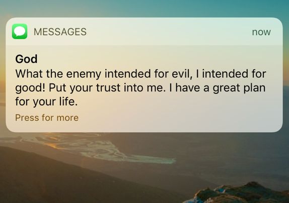 a text message with an image of the ocean in the background that says, god what the enemy intended for evil, i intended for good put your trust into me