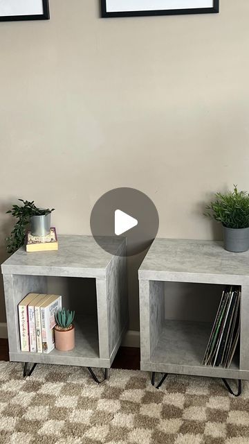 two cement cube tables with plants on top